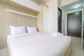 Fully Furnished with Cozy Design Studio Transpark Cibubur Apartment By Travelio